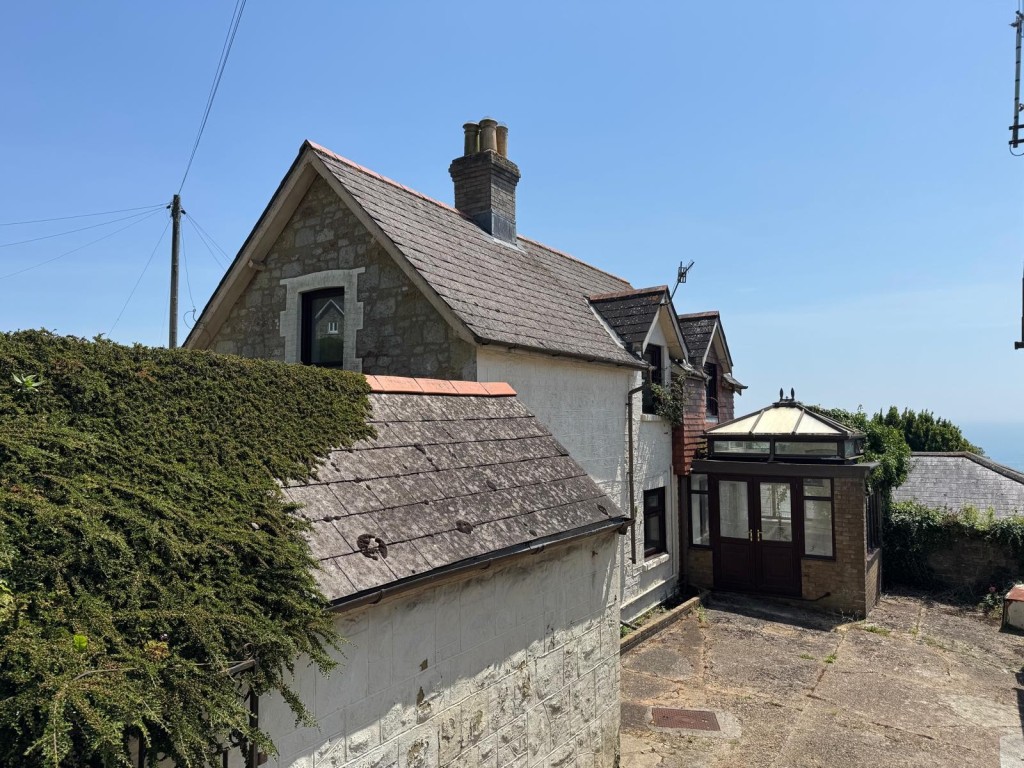 Lot: 88 - TWO-BEDROOM COTTAGE FOR IMPROVEMENT - The Side of the Cottage from Ground level